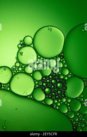 macro photography of air bubbles in liquid green tone background Stock Photo