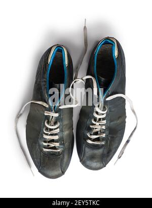 Old football shoes isolated on white background Stock Photo