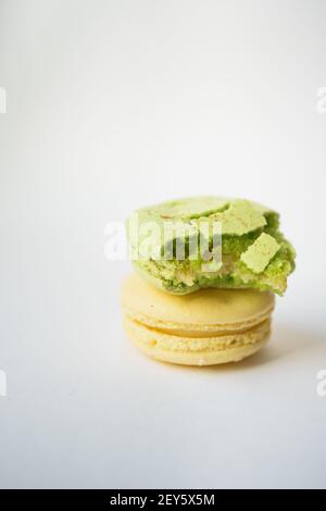green and yellow macaroni on a white background Stock Photo