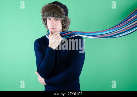 Young attractive guy is drinking a hot drink. Stock Photo