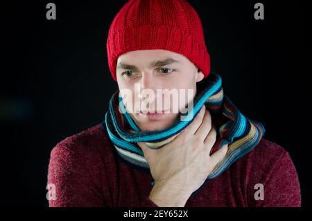 Young attractive guy is drinking a hot drink. Stock Photo