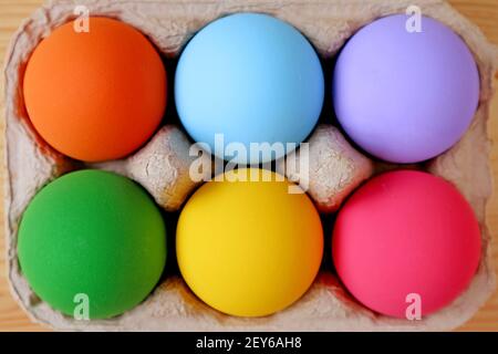 Top View of Multi-colored Easter Eggs in a Carton Stock Photo
