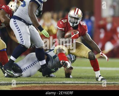 San Francisco 49ers Frank Gore (21) cuts in the backfield in the first  quarter against the Seattle Seahawks at Monster Park in San Francisco on  November 19, 2006. Gore ran for 212