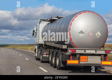 Big gas-tank truck goes on highway Stock Photo