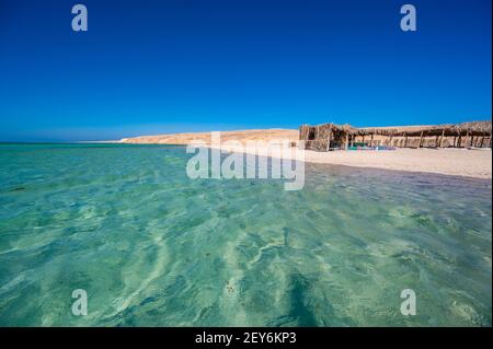 Orange Bay with white beach and crystal clear azure water - paradise coastline of Giftun island, Mahmya, Hurghada, Red Sea, Egypt Stock Photo