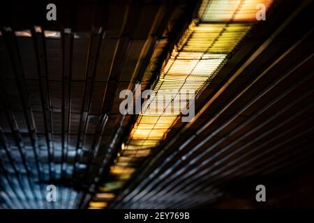 Pedestrian underpass tunnel lights and lamps at hungarian railway station. Stock Photo