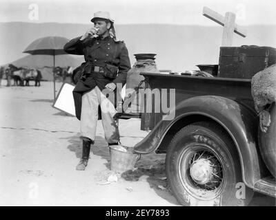 RONALD COLMAN on set location candid during filming of UNDER TWO FLAGS 1936 director FRANK LLOYD novel Ouida A Darryl F. Zanuck Production / 20th Century Pictures / Twentieth Century Fox Stock Photo