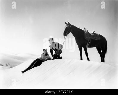 CLAUDETTE COLBERT as Cigarette and RONALD COLMAN as Sergeant Victor in UNDER TWO FLAGS 1936 director FRANK LLOYD novel Ouida A Darryl F. Zanuck Production / 20th Century Pictures / Twentieth Century Fox Stock Photo