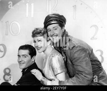 FRANCIS LEDERER CLAUDETTE COLBERT and DON AMECHE Publicity Portrait for MIDNIGHT 1939 director MITCHELL LEISEN screenplay Charles Brackett Billy Wilder Miss Colbert's Gowns by Irene Paramount Pictures Stock Photo