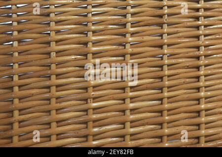 weaving of basket from natural rods closeup Stock Photo