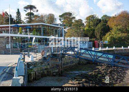 The Mylor Yacht Club with outdoor dining and views from the harbourside on Mylor Creek near Falmouth in Cornwall Stock Photo