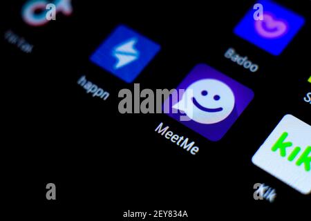 Madrid, Spain- March 3, 2021: Dating app icons on black screen in a smartphone. Happn, Badoo, Meetme, Kik app icons. Stock Photo