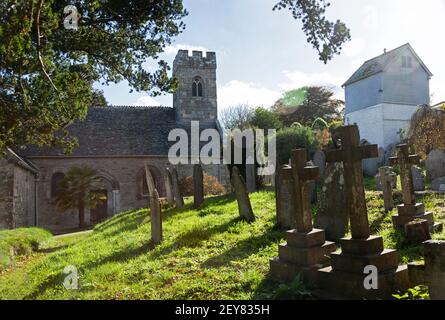 The decorated side entrance to the parish coastal Church of St Mylor near Penryn and Falmouth in Cornwall, UK Stock Photo