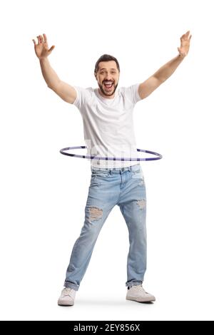 Full length portrait of a happy young man playing with a hula hoop isolated on white background Stock Photo