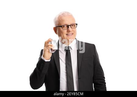 Mature man in a suit and tie spraying a perfume isolated on white background Stock Photo
