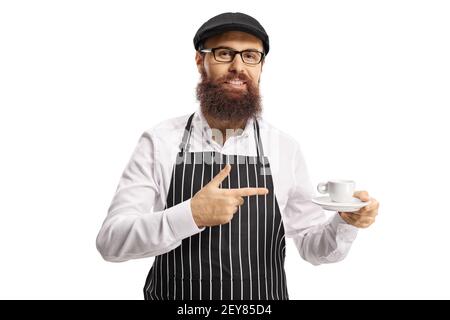 Bearded man with an apron holding an espresso coffee and pointing isolated on white background Stock Photo