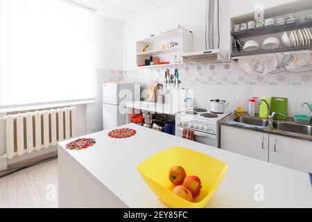 Small Kitchen Interior in Kindergarten with Apple Fruits. Stock Photo