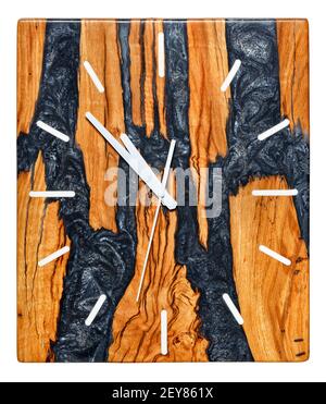 Beautiful rectangular wall clock made of a cut of a tree root and epoxy resin with an imitation of solidified lava of a volcano, isolated on a white Stock Photo