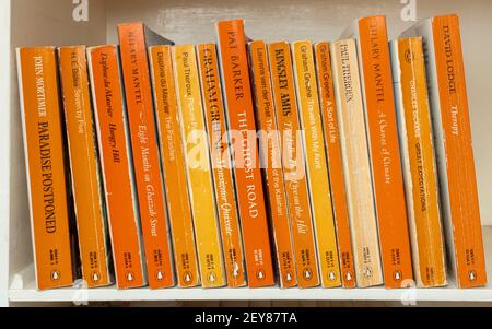 Collection of Penguin paperback books on a bookshelf, UK Stock Photo