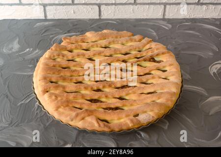 Homemade yeast dough pie. Pastries with sweet fruit filling. Close-up, selective focus. Stock Photo
