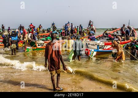 Senegal, arrival of fishing in Mbour. M'bour (or M'Bour or Mbour) is a town in western Senegal, located on the Petite-Côte, about 80 km south of Dakar Stock Photo