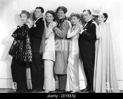 HEDDA HOPPER FRANCIS LEDERER MARY ASTOR DON AMECHE CLAUDETTE COLBERT JOHN BARRYMORE and ELAINE BARRIE Posed Group Publicity Portrait for MIDNIGHT 1939 director MITCHELL LEISEN screenplay Charles Brackett Billy Wilder Miss Colbert's Gowns by Irene Paramount Pictures Stock Photo