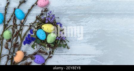 Happy Easter. Easter eggs. Willow twigs. Holy Easter. Easter eggs in the nest. Stock Photo