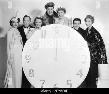 ELAINE BARRIE JOHN BARRYMORE MARY ASTOR DON AMECHE CLAUDETTE COLBERT FRANCIS LEDERER and HEDDA HOPPER Posed Group Publicity Portrait for MIDNIGHT 1939 director MITCHELL LEISEN screenplay Charles Brackett Billy Wilder Miss Colbert's Gowns by Irene Paramount Pictures Stock Photo