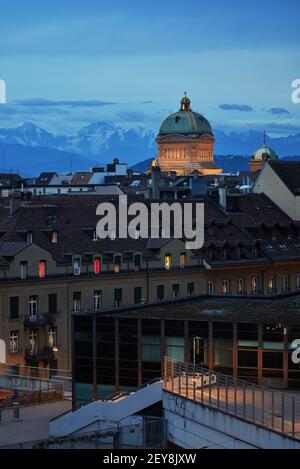 View over the town of Bern to the Bundeshaus in the evening light against a mountain backdrop - Bern, Switzerland Stock Photo