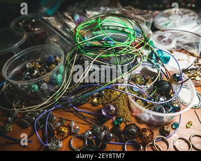 Creative mess on the table. Jewerly Accessories for crafting. Stock Photo