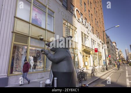 Asbestos workers set up a giant rat outside 111 Eighth Avenue