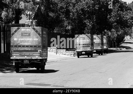 JOHANNESBURG, SOUTH AFRICA - Jan 06, 2021: Johannesburg, South Africa - October 19, 2014: Small TukTuk Grocery Store Home Delivery Vehicles driving th Stock Photo