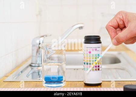 Checking tap water Stock Photo
