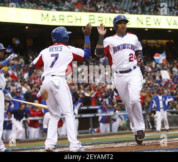 Dominican Republic's Jose Reyes, left, celebrates with teammate Nelson Cruz  their 9-0 victory over Panama at a World Baseball Classic game in San Juan,  Sunday, March 8, 2009. (AP Photo/Fernando Llano Stock