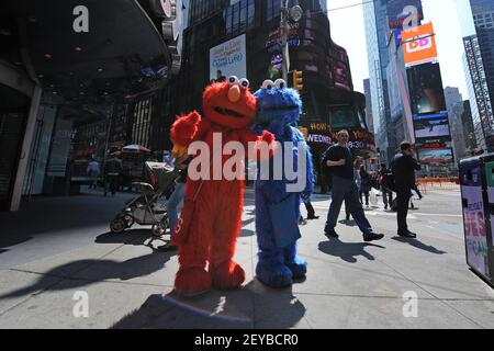 Two Sesame Street cartoon characters entertainers (Big Bird Elmo ...