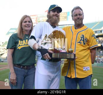 Josh Reddick and his folks on the day he received his Gold Glove
