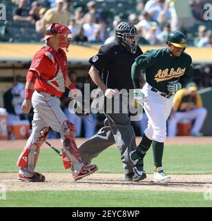 The Oakland Athletics' Yoenis Cespedes, right, is greeted at home