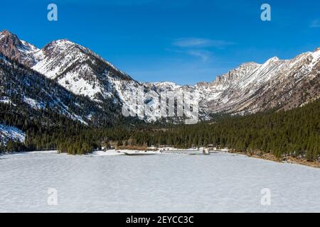 Aerial view of Twin Lakes California covered with snow and ice during winter.