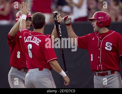 North Carolina State's Trea Turner (8) throws to first for the