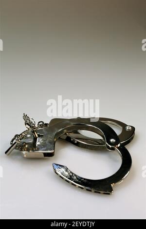 handcuffs and keys Stock Photo