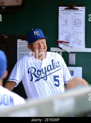 Kansas City Royals hitting coach George Brett (5) checked to see how tall  the teams first round draft pick Hunter Dozier was, after he signed and  watched batting practice before Monday's baseball