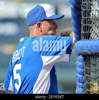 Kansas City Royals hitting coach George Brett (5) checked to see how tall  the teams first round draft pick Hunter Dozier was, after he signed and  watched batting practice before Monday's baseball