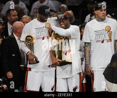 With trophies in hand, the Miami Heat's LeBron James and Dwyane Wade