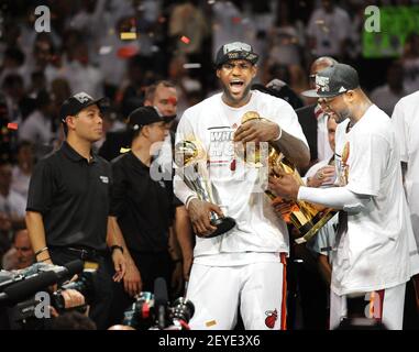With trophies in hand, the Miami Heat's LeBron James and Dwyane Wade
