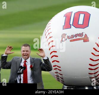 Former Atlanta Braves' Chipper Jones, seated center, is joined by