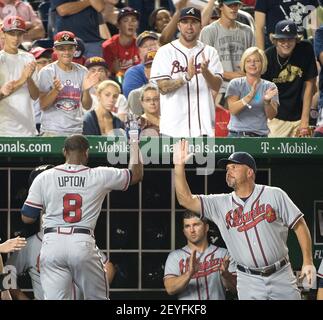 Justin Upton #8 of the Atlanta Braves hits a walk-off homer against the Washington  Nationals at Turner Field.