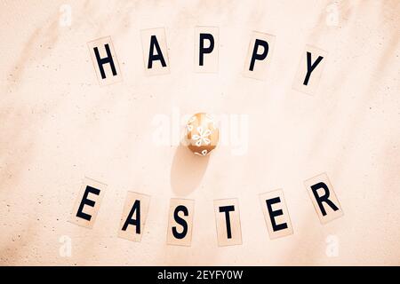 Minimalistic Easter composition. Retro style text. Top view. Flat lay Stock Photo