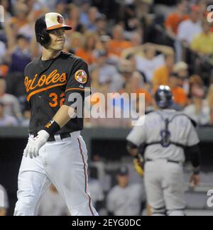 Baltimore Orioles' Matt Wieters (32) celebrates in the dugout