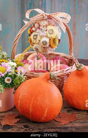 Pumpkins on rustic wooden table. Autumn decor Stock Photo