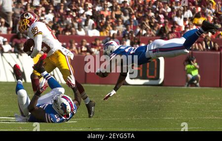 Buffalo Bills strong safety Aaron Williams (23) intercepts a pass intended  for Baltimore Ravens wide receiver Torrey Smith (82) in the end zone during  the third quarter at Ralph Wilson Stadium in